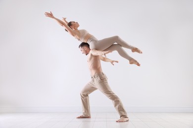 Photo of Couple of professional dancers training in studio