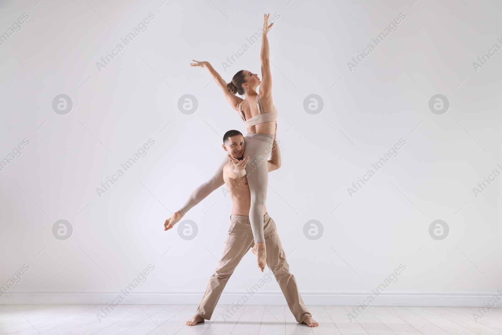 Couple of professional dancers training in studio Photo of Couple of professional dancers training in studio