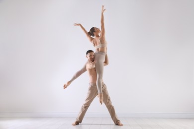 Photo of Couple of professional dancers training in studio