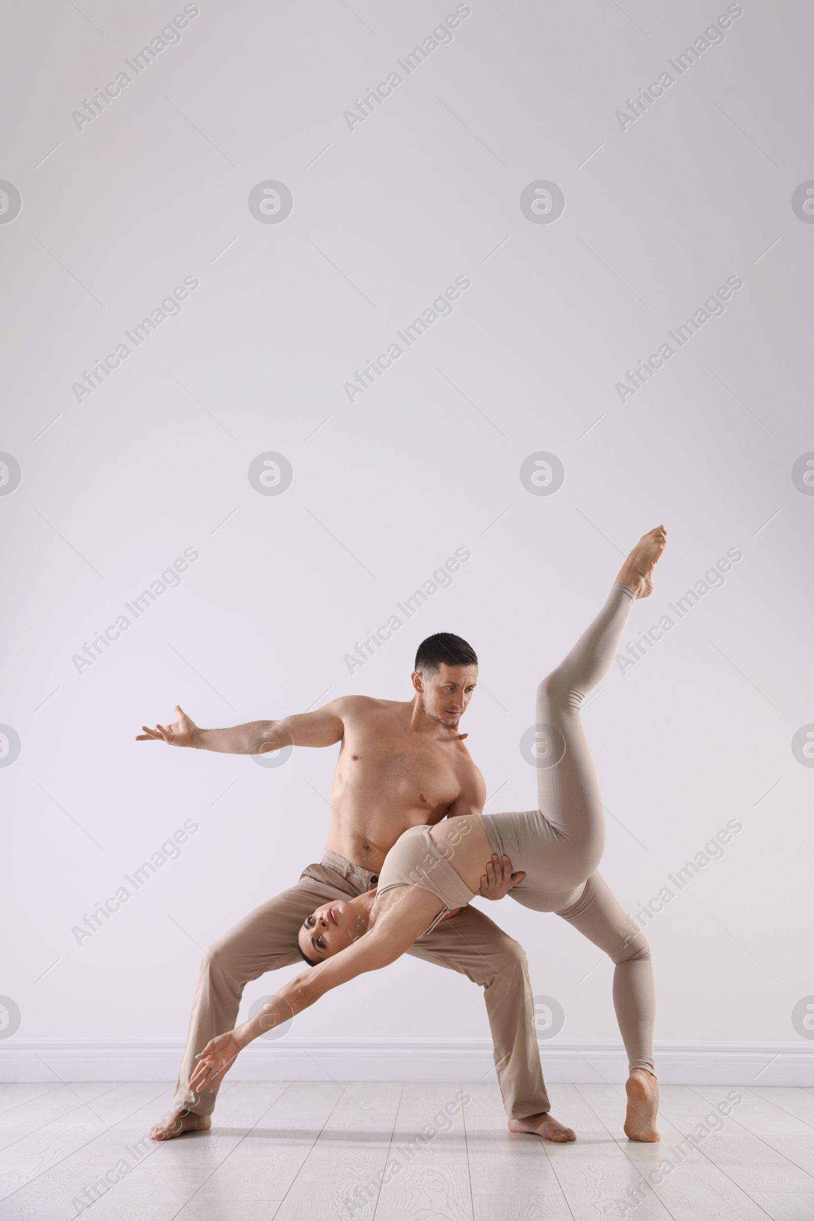 Couple of professional dancers training in studio Photo of Couple of professional dancers training in studio