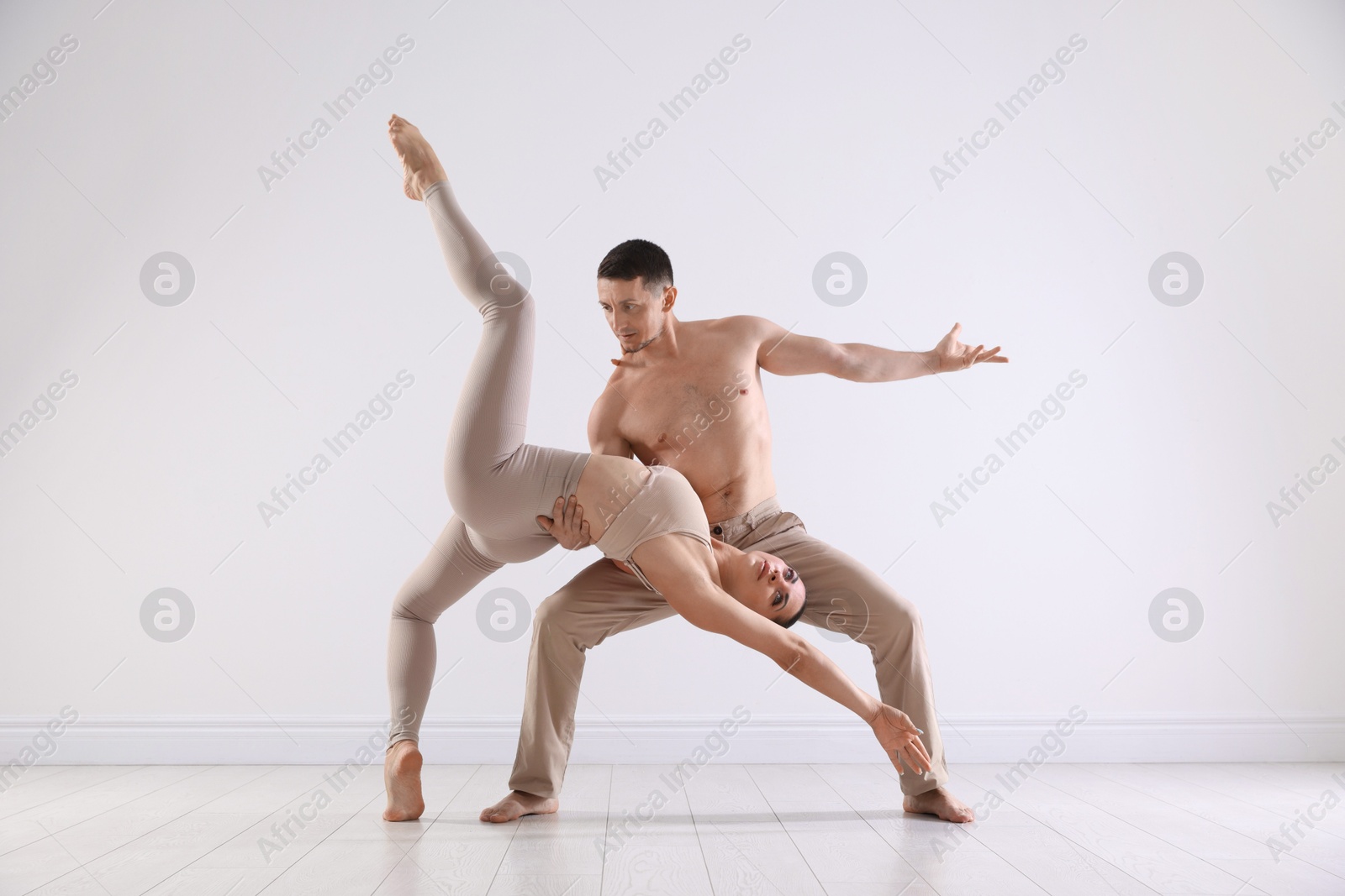 Couple of professional dancers training in studio Photo of Couple of professional dancers training in studio