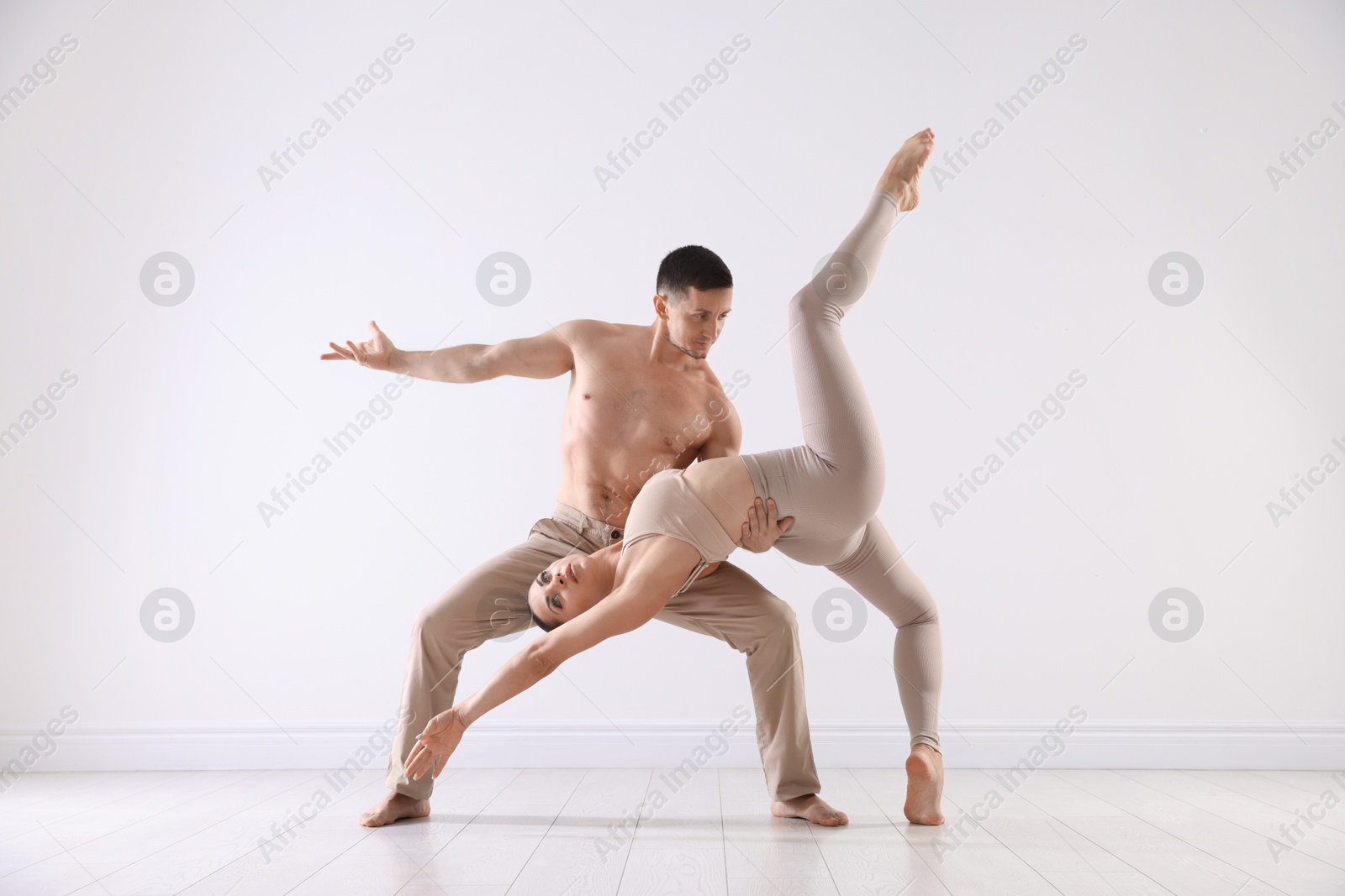 Couple of professional dancers training in studio Photo of Couple of professional dancers training in studio