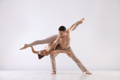 Photo of Couple of professional dancers training in studio