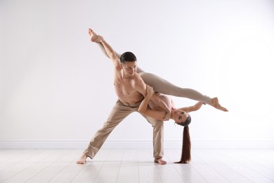 Photo of Couple of professional dancers training in studio