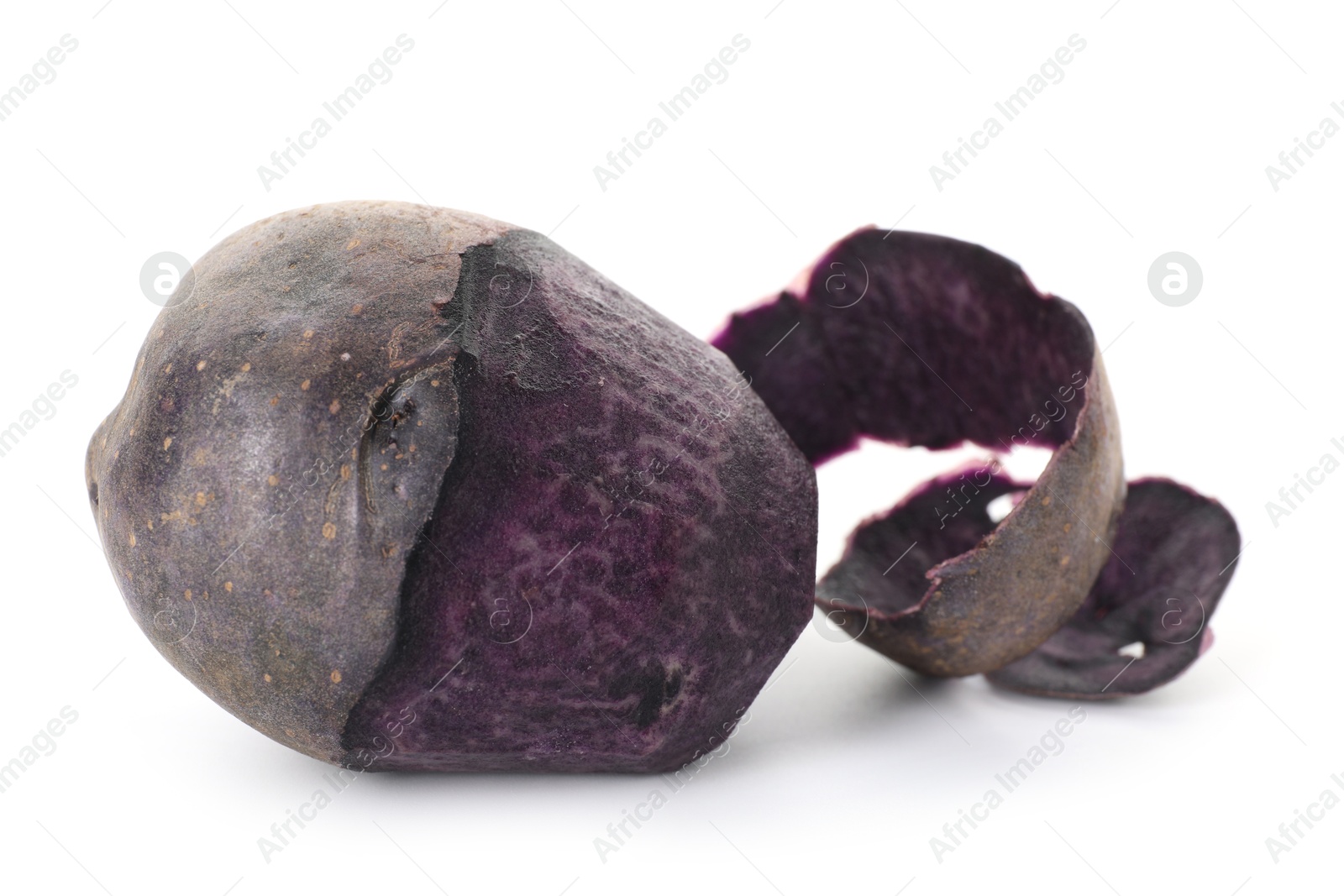 Photo of Raw purple potato with peel isolated on white