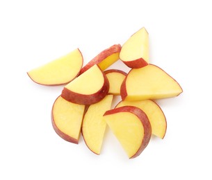 Photo of Pieces of fresh red potatoes isolated on white, top view