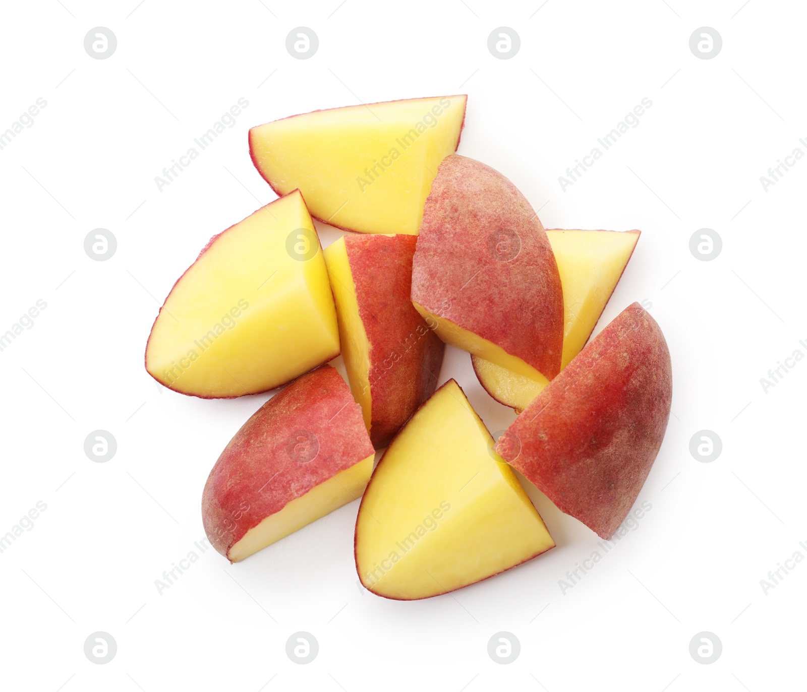 Pieces of fresh red potatoes isolated on white, top view Photo of Pieces of fresh red potatoes isolated on white, top view