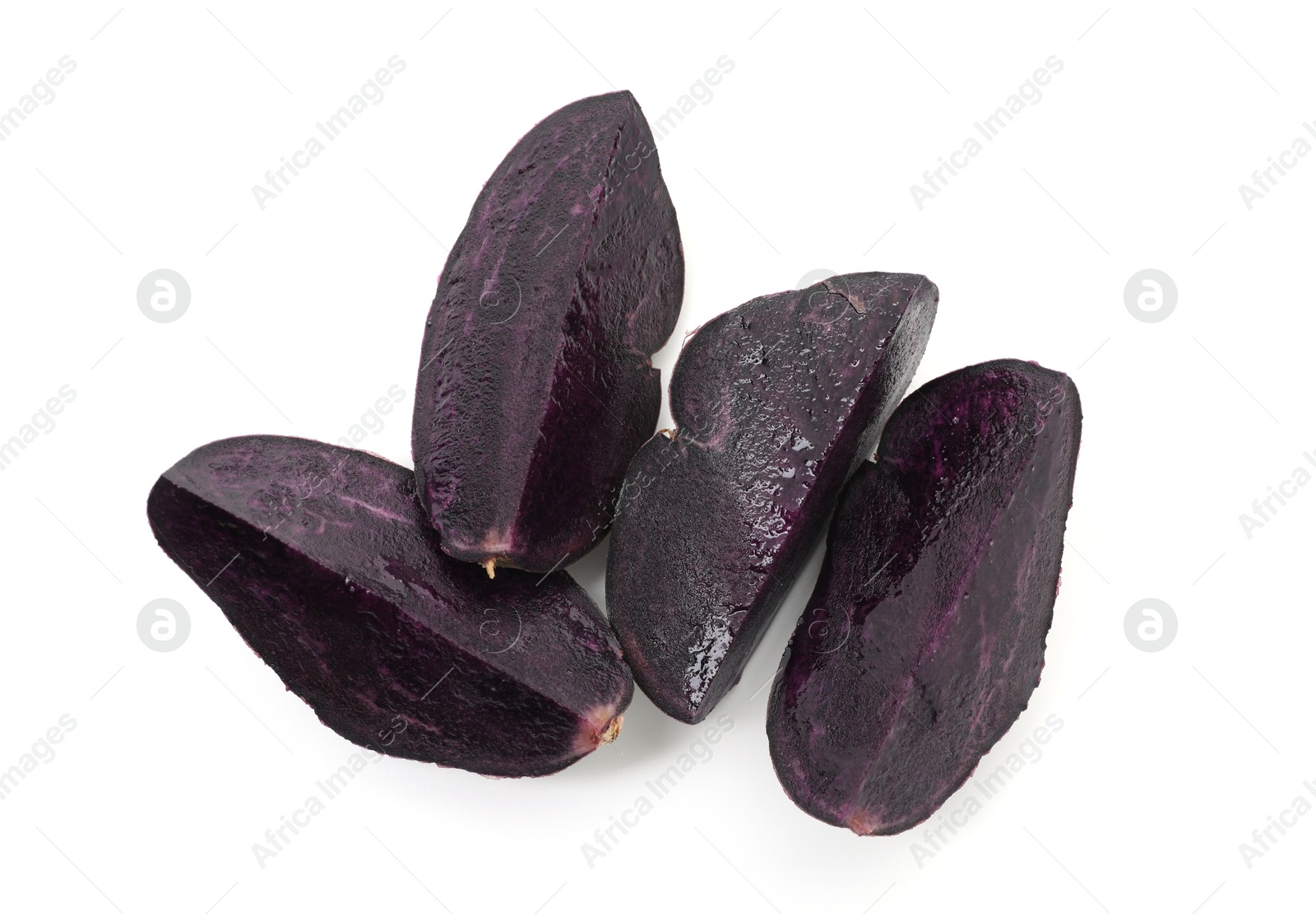 Pieces of fresh purple potato isolated on white, top view Photo of Pieces of fresh purple potato isolated on white, top view