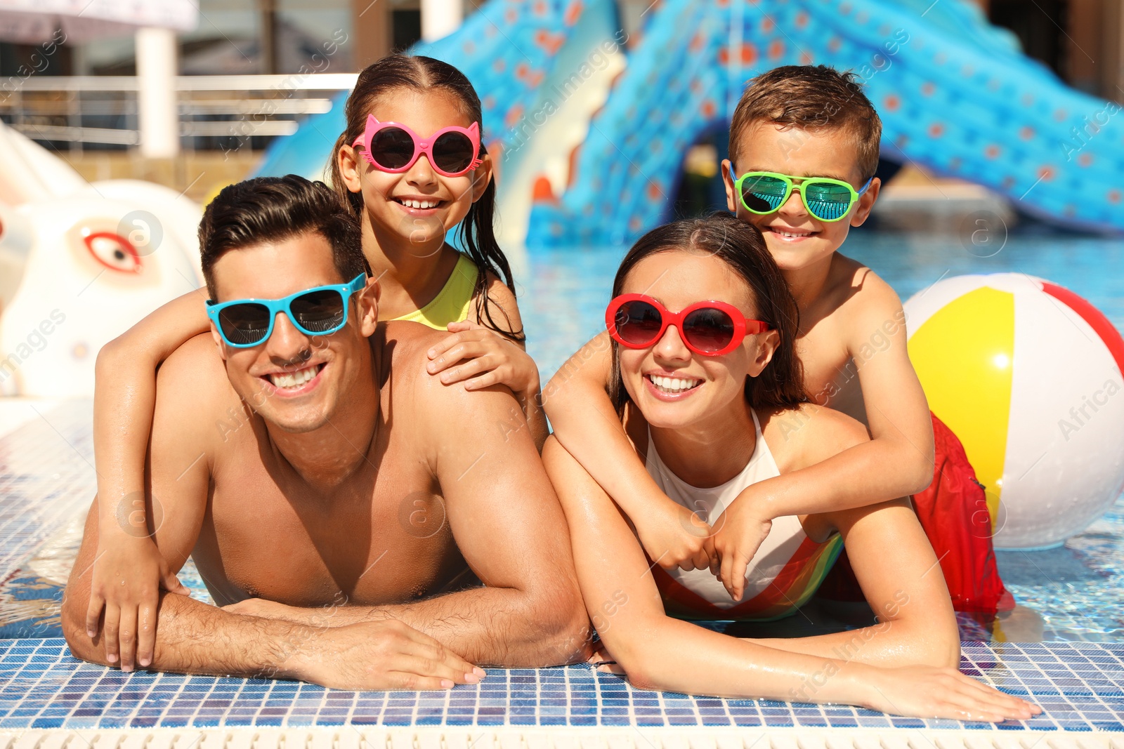 Happy family in swimming pool. Summer vacation Photo of Happy family in swimming pool. Summer vacation