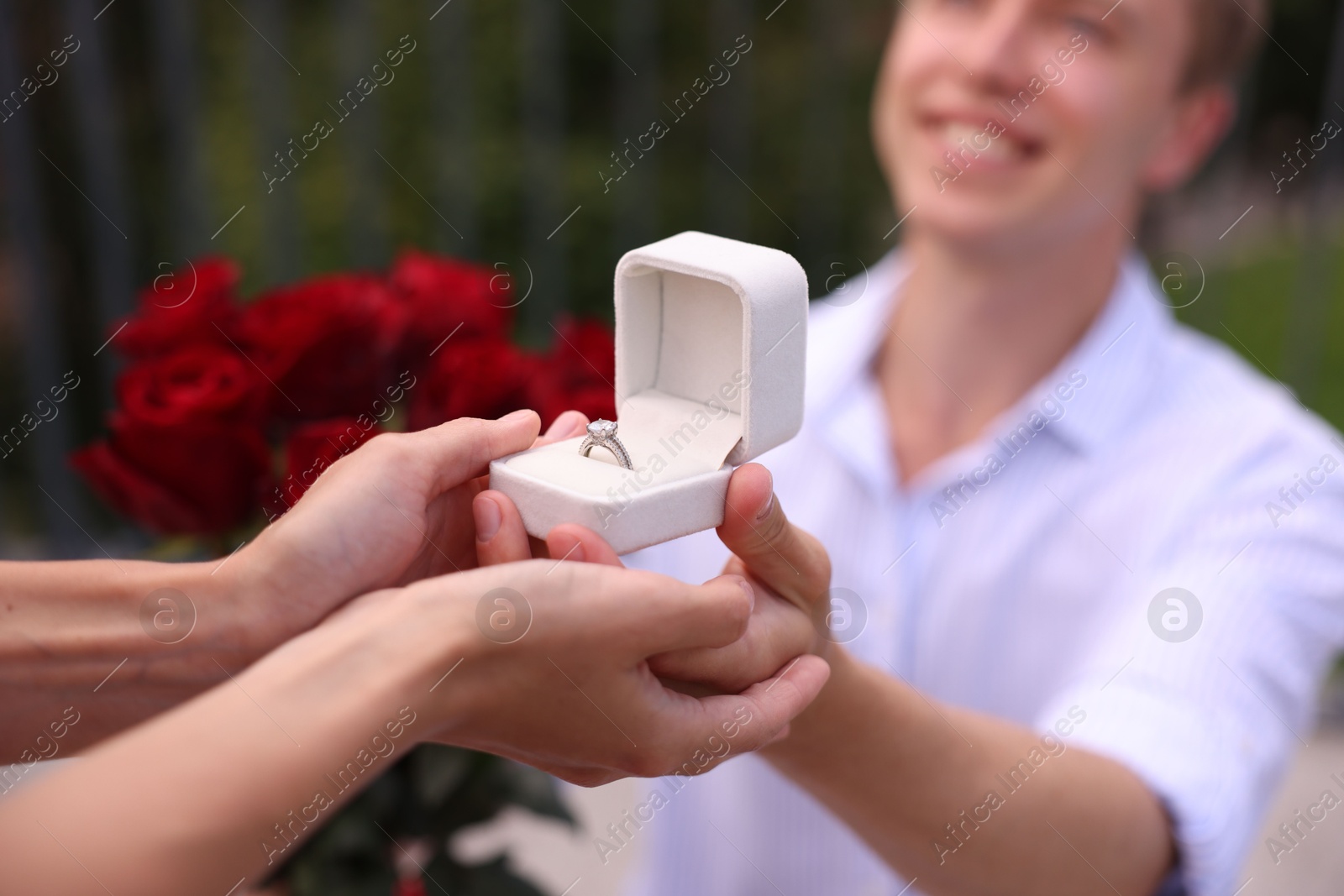 Man with engagement ring making marriage proposal to his girlfriend outdoors, closeup Photo of Man with engagement ring making marriage proposal to his girlfriend outdoors, closeup