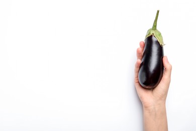 Photo of Woman with fresh eggplant on white background, top view. Space for text