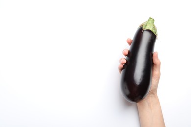 Photo of Woman with fresh eggplant on white background, top view. Space for text