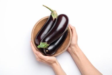 Photo of Woman with bowl of fresh eggplants on white background, top view