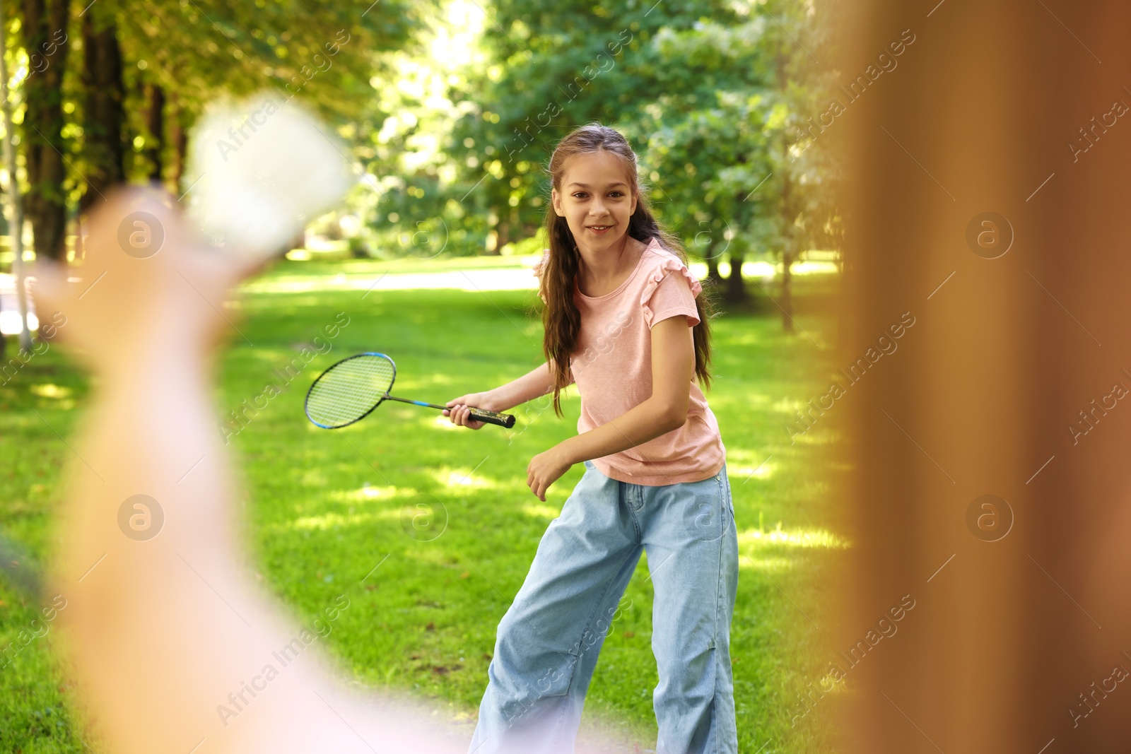 Cute little girls playing badminton in park, closeup Photo of Cute little girls playing badminton in park, closeup