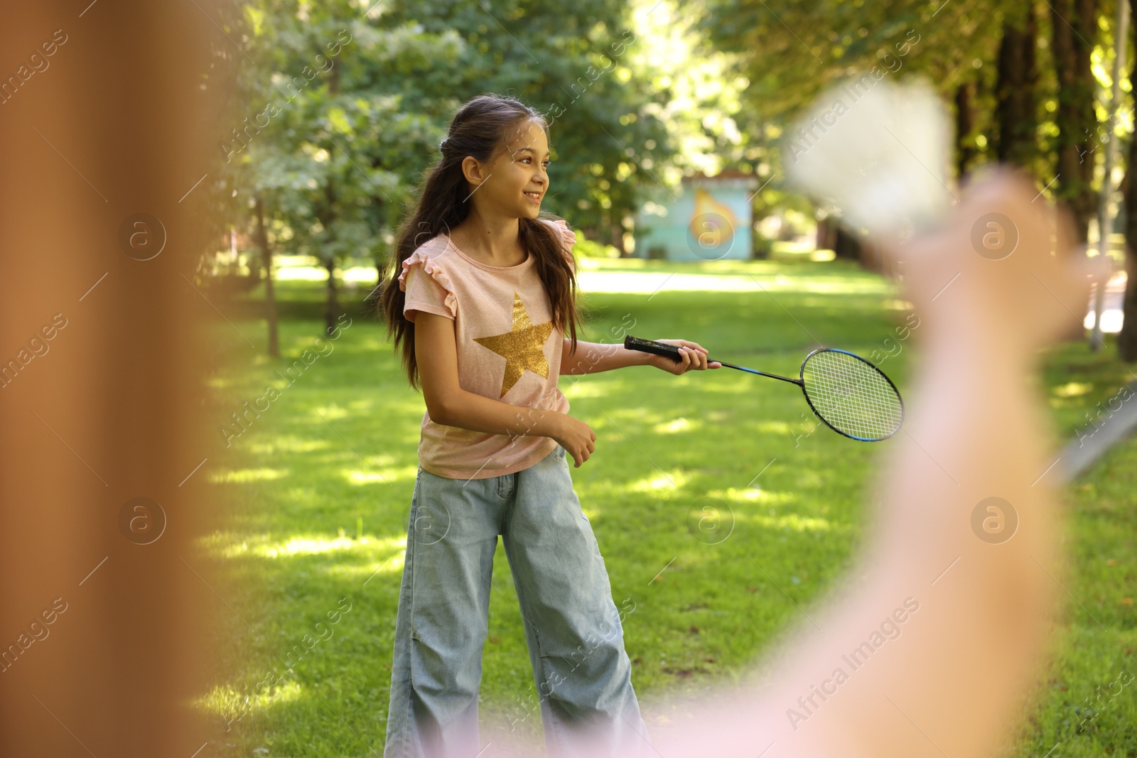 Cute little girls playing badminton in park, closeup Photo of Cute little girls playing badminton in park, closeup