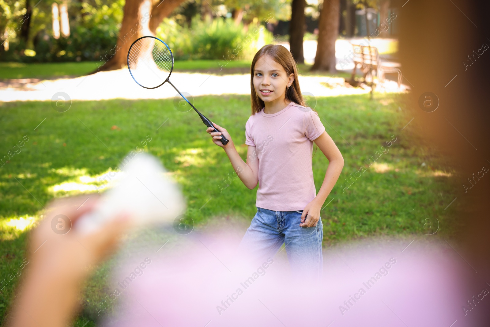 Cute little girls playing badminton in park, closeup Photo of Cute little girls playing badminton in park, closeup