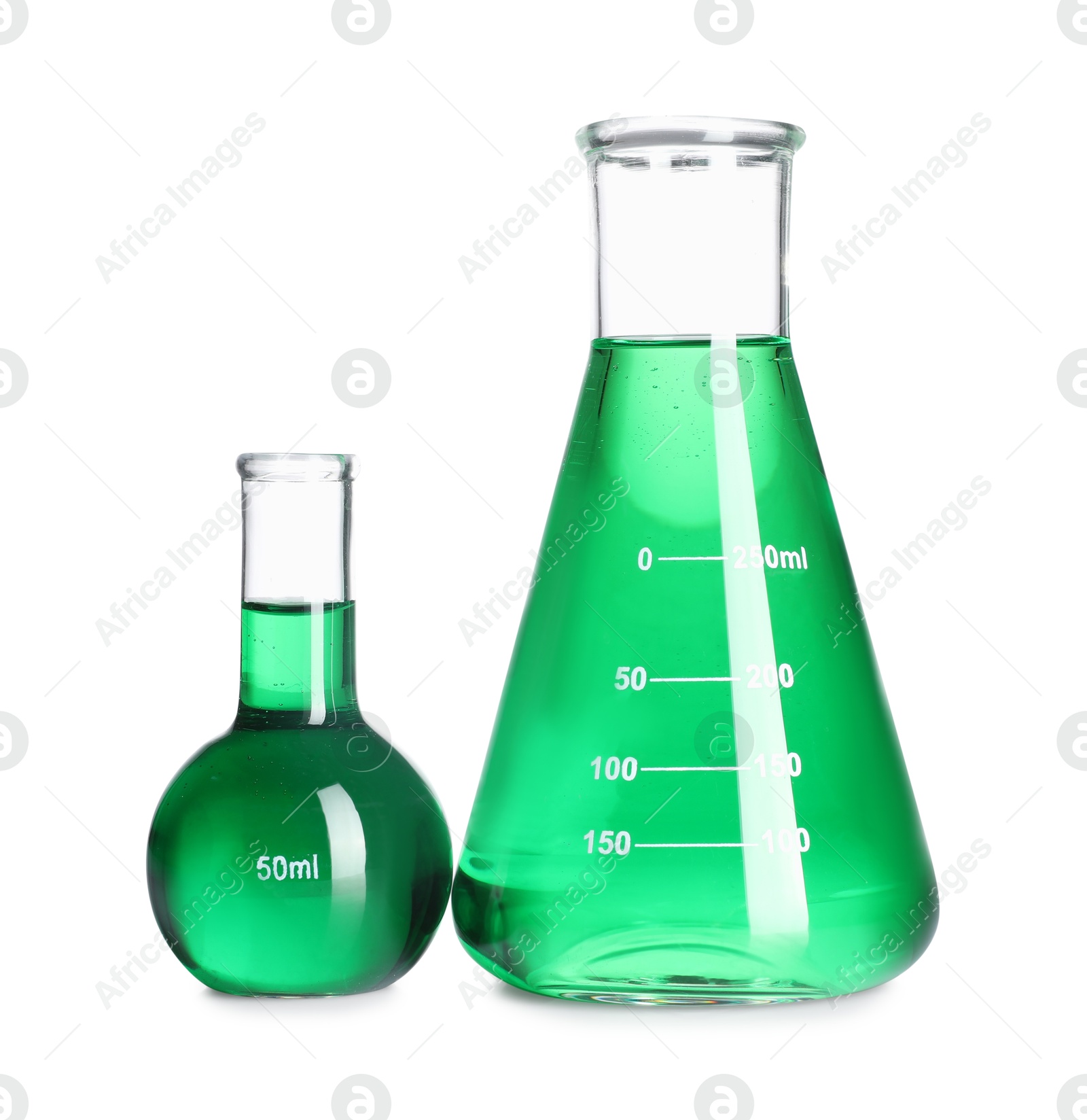 Photo of Laboratory glassware with green liquid isolated on white