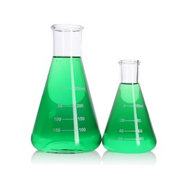 Photo of Flasks with green liquid on mirror surface isolated on white