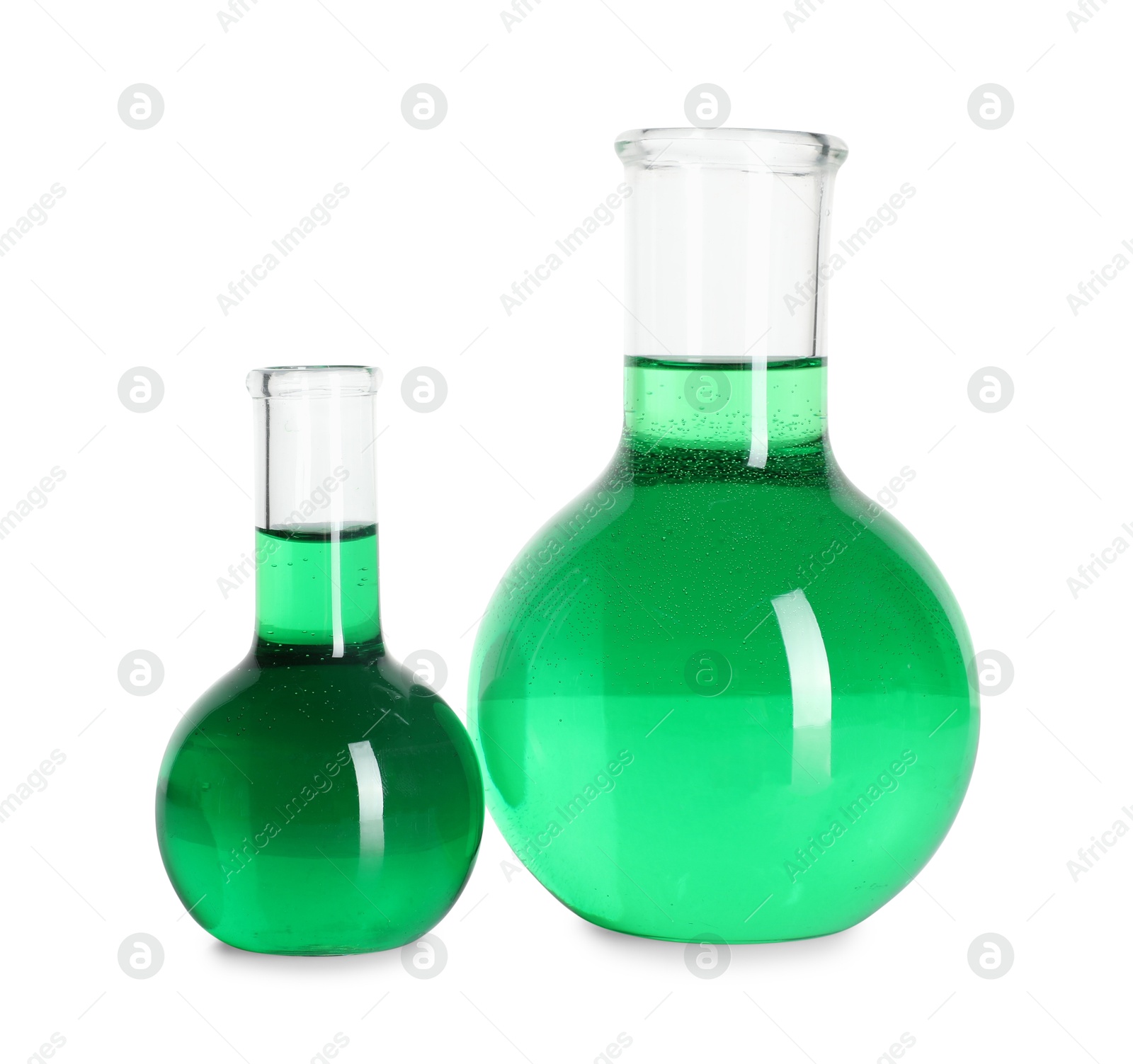 Photo of Flasks with green liquid isolated on white