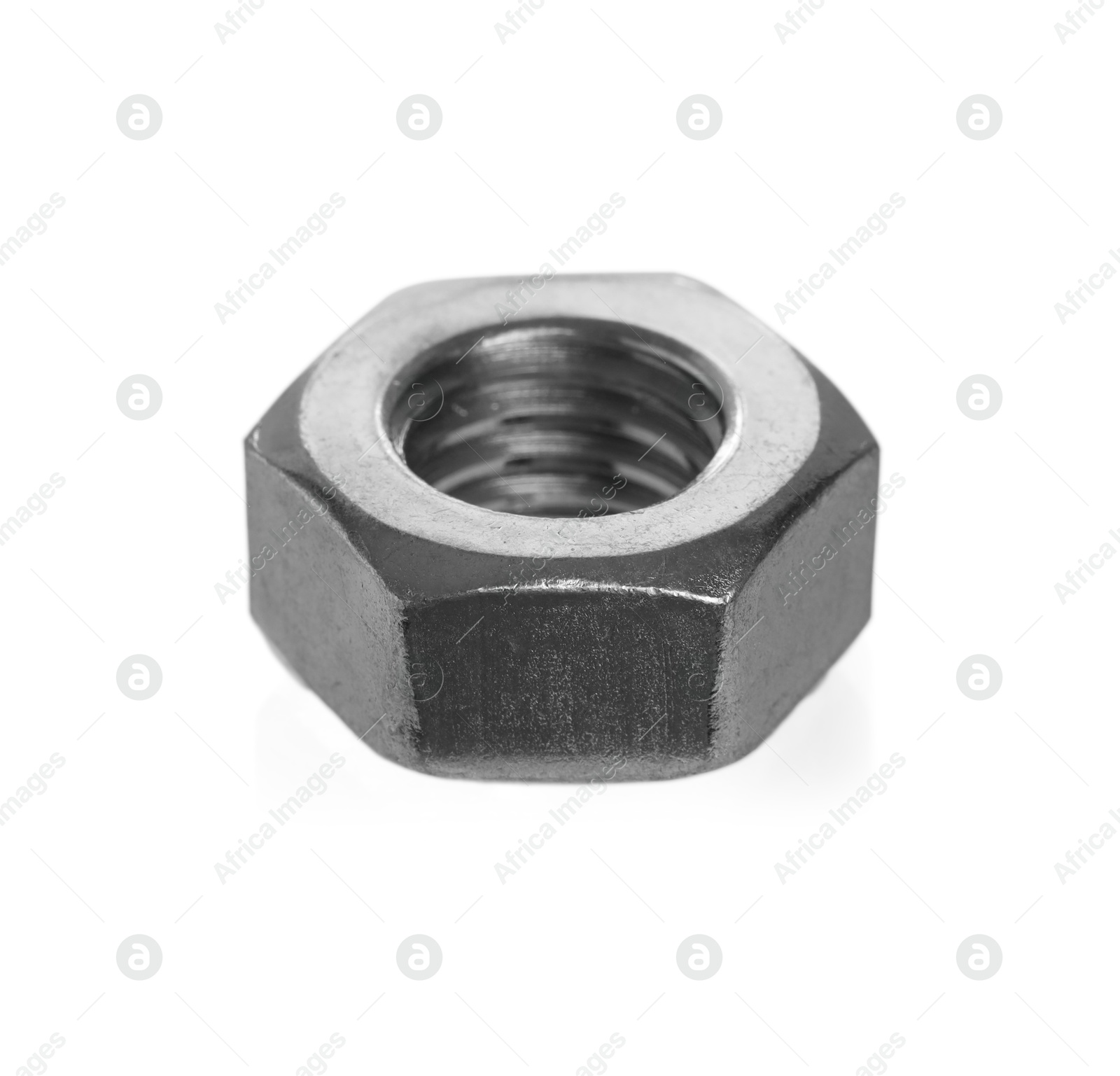 Photo of One metal hex nut isolated on white. Hardware tool
