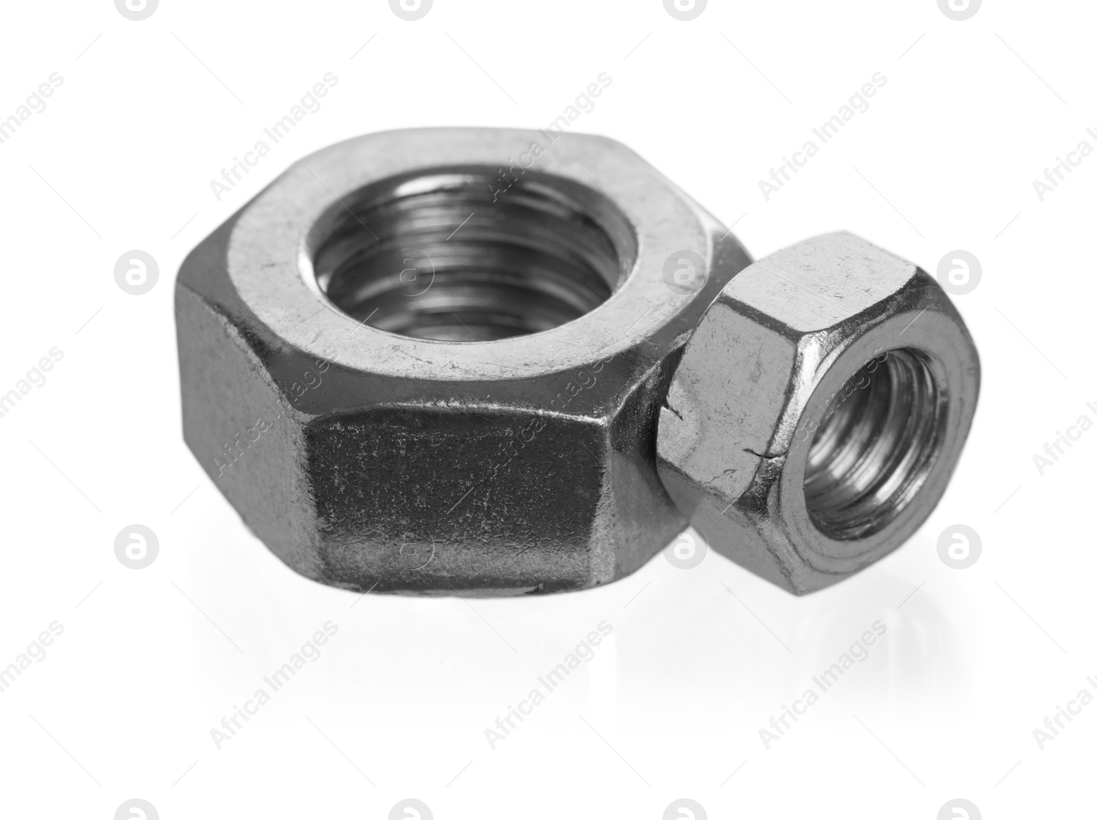 Photo of Metal hex nuts isolated on white. Hardware tool