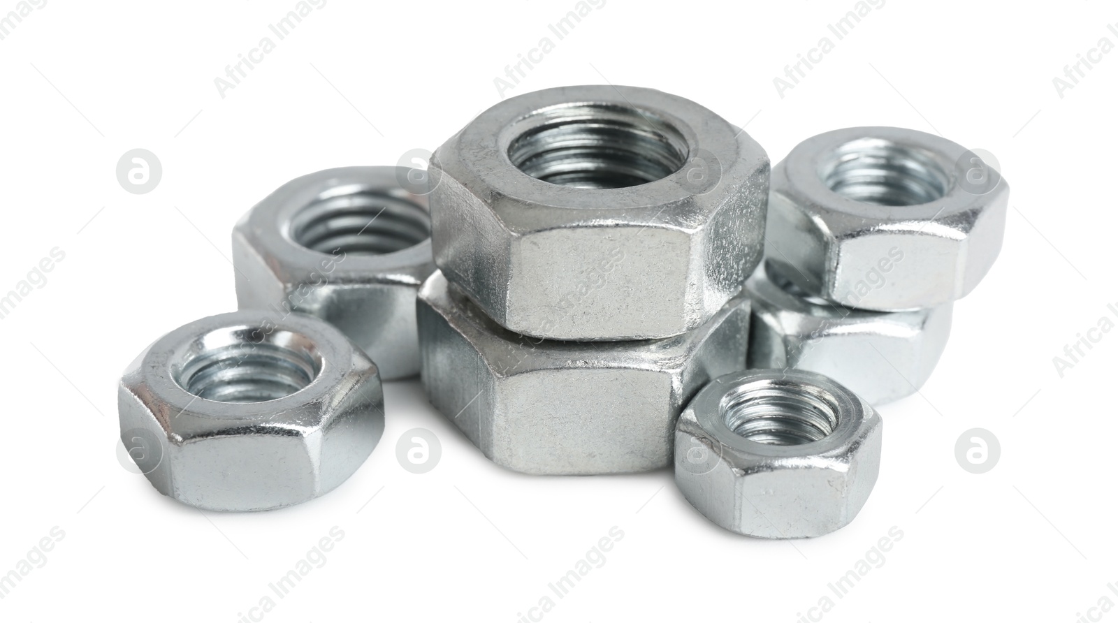 Metal hex nuts isolated on white. Hardware tool Photo of Metal hex nuts isolated on white. Hardware tool