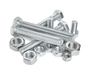 Photo of Metal bolts and hex nuts isolated on white
