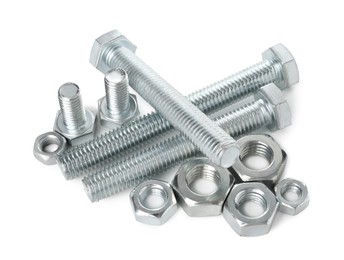 Photo of Metal bolts and hex nuts isolated on white