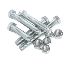 Photo of Metal bolts and hex nuts isolated on white