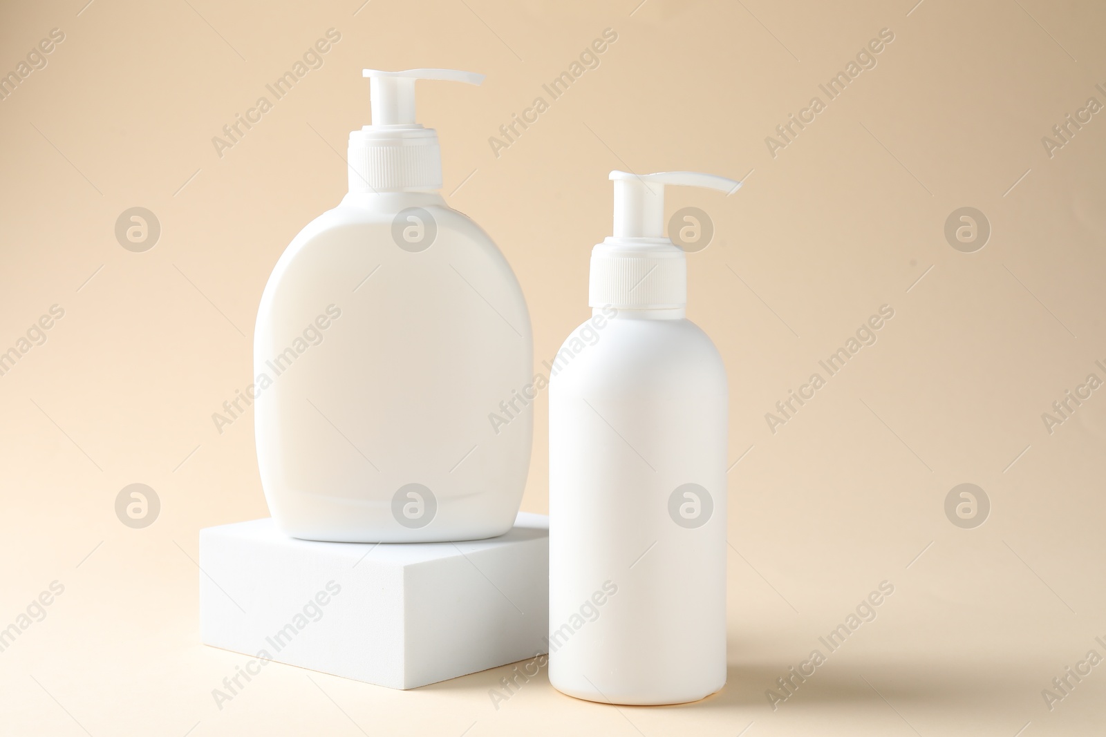 Promotion. Cosmetic products and podium on beige background Photo of Promotion. Cosmetic products and podium on beige background
