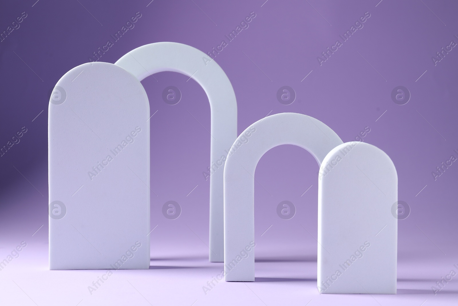 Promotion. Different podiums for product presentation on violet background Photo of Promotion. Different podiums for product presentation on violet background