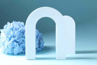 Photo of Promotion. White figures and cloth on light blue background
