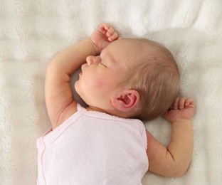Photo of Cute newborn baby sleeping on bed, top view