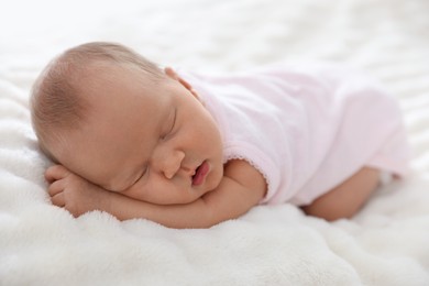 Photo of Cute newborn baby sleeping on bed indoors