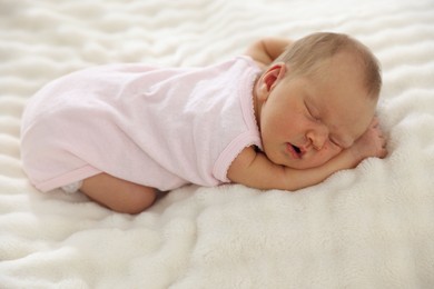 Photo of Cute newborn baby sleeping on bed indoors