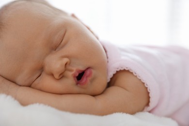 Photo of Cute newborn baby sleeping on bed indoors