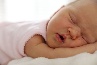 Photo of Cute newborn baby sleeping on bed indoors