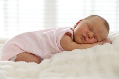 Photo of Cute newborn baby sleeping on bed indoors