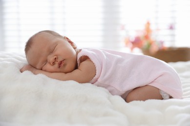 Photo of Cute newborn baby sleeping on bed indoors