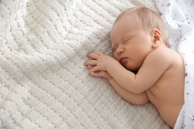 Photo of Cute newborn baby sleeping on bed, top view. Space for text