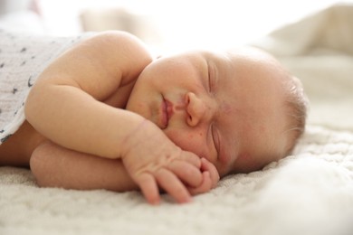 Photo of Cute newborn baby sleeping on bed indoors
