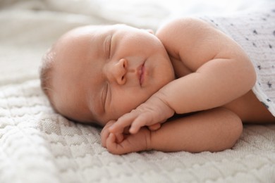 Photo of Cute newborn baby sleeping on bed indoors