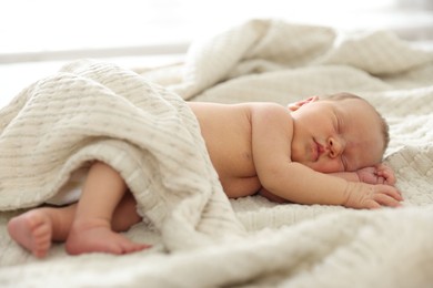 Photo of Cute newborn baby sleeping on bed indoors