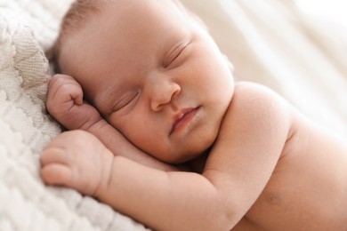 Photo of Cute newborn baby sleeping on bed indoors