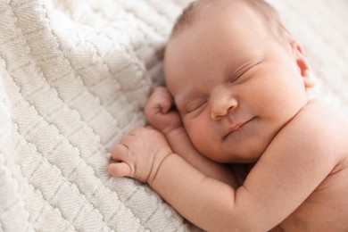 Photo of Cute newborn baby sleeping on bed indoors