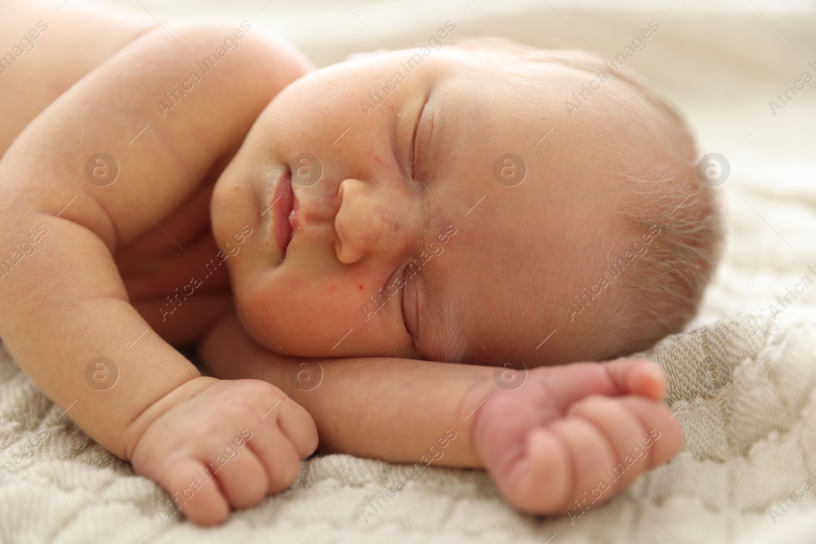Cute newborn baby sleeping on bed indoors Photo of Cute newborn baby sleeping on bed indoors