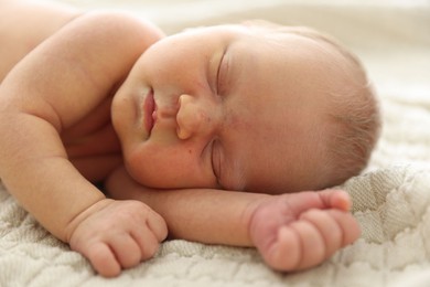Photo of Cute newborn baby sleeping on bed indoors