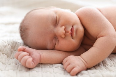 Photo of Cute newborn baby sleeping on bed indoors