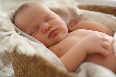 Photo of Cute newborn child sleeping in baby nest indoors