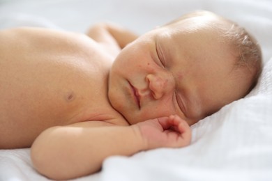 Photo of Cute newborn baby sleeping on bed indoors
